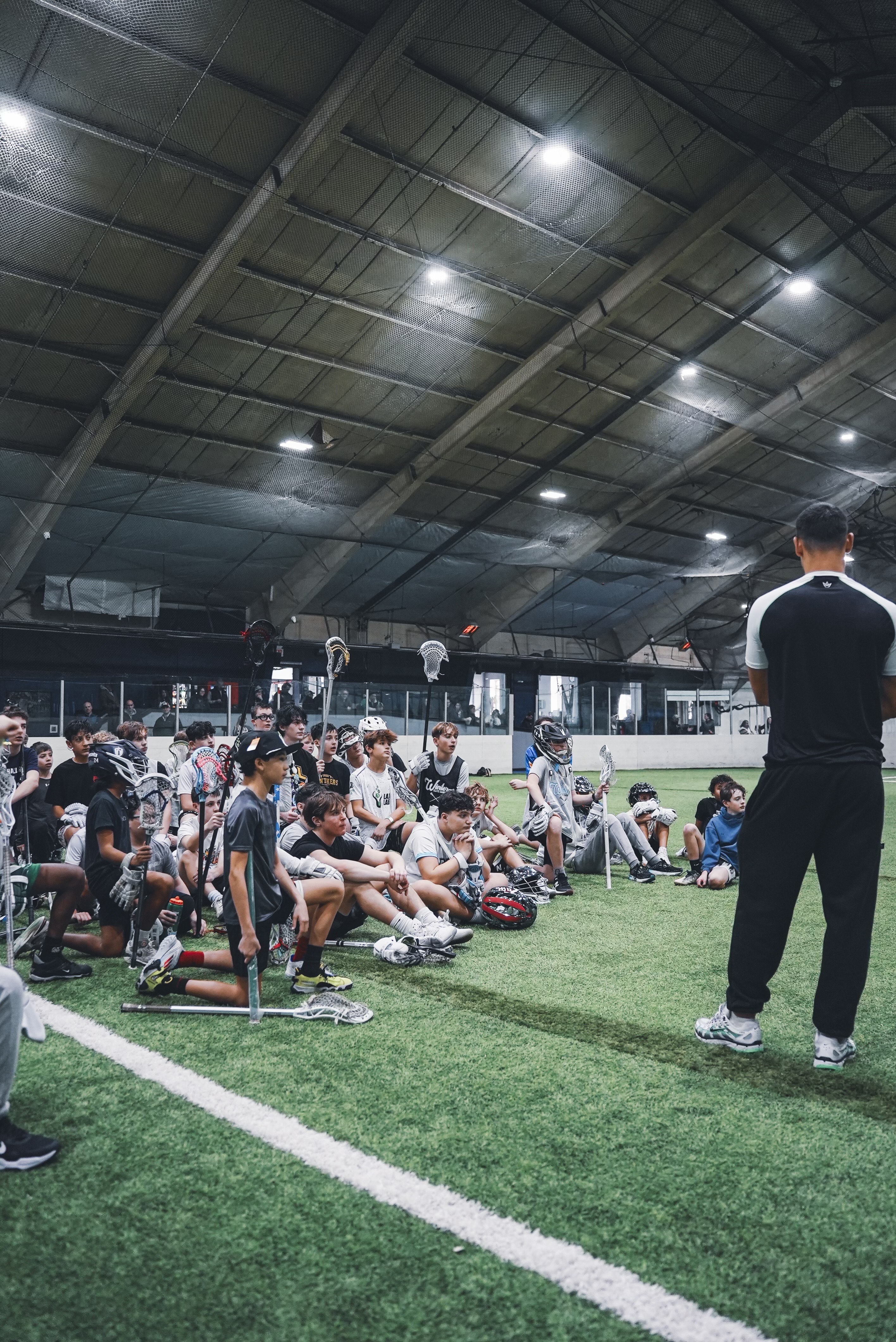 LaxLab coach speaking to group of young players